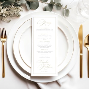 Op de afbeelding: Een witte menukaart voor een bruiloft met gouden letters. Het menu bevat voorgerechten, hoofdgerechten, dessert en koffie en thee. De kaart is versierd met een gouden rand en de namen "Cecilia en Matthew" staan ​​onderaan in cursief.