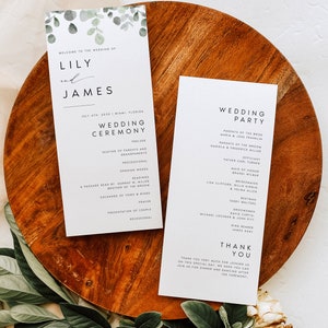 May include: Wedding ceremony programme and wedding party information card featuring a eucalyptus leaf design. The programme lists the order of events for the ceremony, including seating of parents and grandparents, processional, opening words, readings, exchange of vows and rings, prayer, presentation of the couple, and recessional. The wedding party card lists the names of the parents of the bride and groom, the officiant, maid of honour, bridesmaids, best man, and groomsmen.
