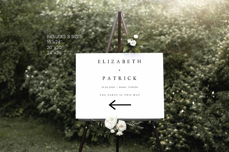 May include: White wedding sign with black text on an easel. The sign reads "ELIZABETH + PATRICK 10.26.2025 MIAMI, FLORIDA THE PARTY IS THIS WAY" with a black arrow pointing left.