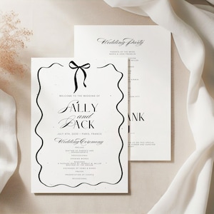May include: A pair of wedding stationery cards. The main card has a black bow and decorative border, with the names "Sally and Jack" and wedding details. The second card lists the wedding party.