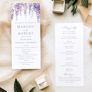 May include: Two white wedding programme cards with black serif and script text. The left card features a purple wisteria watercolour illustration at the top, listing Margot and Robert, 26.06.2026, and ceremony details. The right card lists the wedding party.
