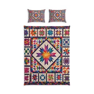 May include: A colorful quilt and two matching pillowcases. The quilt features a large central starburst design in a diamond shape, surrounded by various star and geometric patterns in vibrant colors. The pillowcases have a similar starburst design.