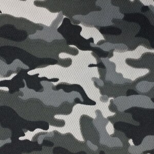 May include: Gray camouflage fabric with a mesh texture. The fabric has a repeating pattern of dark gray, light gray, and white shapes.