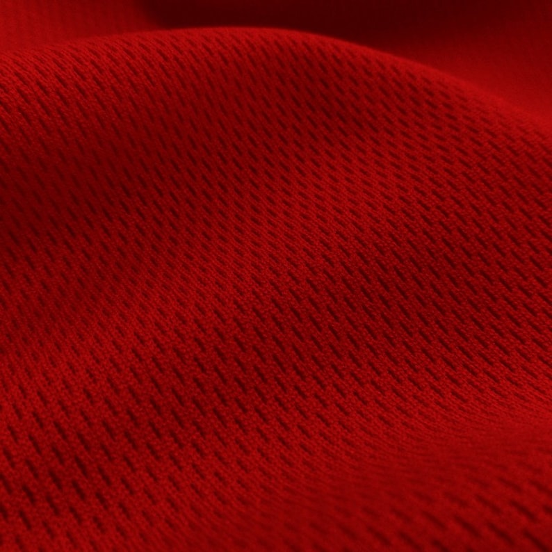 May include: Close-up of a red fabric with a textured, woven pattern. The fabric has a slightly shiny finish.