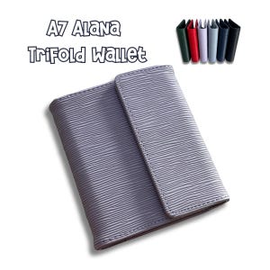 May include: A7 Alana Trifold Wallet in a light gray color with a textured finish.
