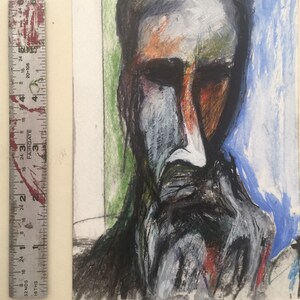May include: An abstract portrait painting of a man with a beard. The artwork uses a palette of dark grays, oranges, and blues. A ruler with inch measurements is visible on the left side of the image.