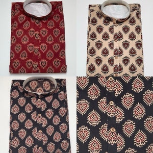 May include: Four different patterned shirts with a mandarin collar and button closure. The shirts are in red, beige, black, and white with a brown paisley pattern.