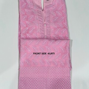 May include: A pink embroidered kurta with a lace trim. The kurta has a V-neck and a button closure. The text "FRONT SIDE - KURTI" is visible on the image.
