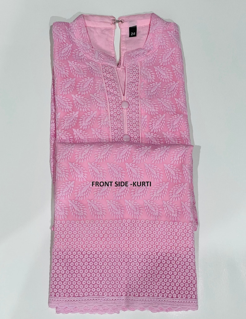 May include: A pink embroidered kurta with a lace trim. The kurta has a V-neck and a button closure. The text "FRONT SIDE - KURTI" is visible on the image.