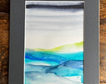 Modern and contemporary abstract landscape watercolour painting. Restful and calming with blues, greys and greens.