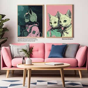 May include: Two digital art prints featuring cats in space suits. The first print shows a cat wearing a pink and green space suit with a helmet. The second print shows two cats wearing green and white space suits. The text "Glorious Critters" is printed below the second print.