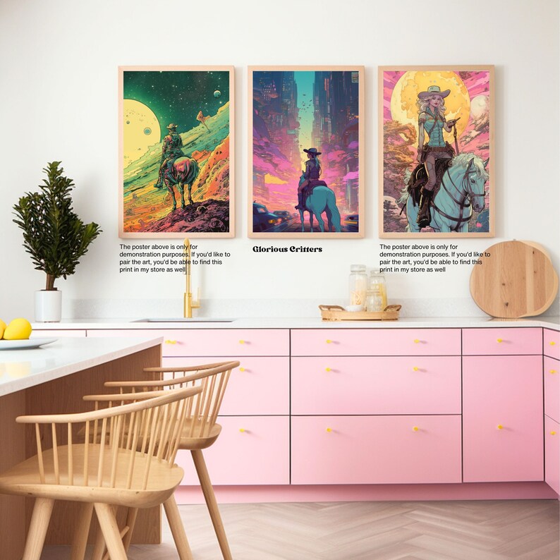May include: Three digital art prints featuring a woman riding a horse in a futuristic setting. The prints are framed and displayed on a pink wall in a kitchen.