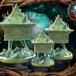 May include: Three miniature houses with green and gold paint, each with a different base. The largest house is labeled "Dice Tower", the middle house is labeled "Mini", and the smallest house is labeled "Dice Vault".