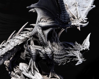 May include: A detailed, grayscale dragon figurine with large wings, sharp claws, and a menacing open mouth. The dragon is posed on a rocky base. Text at the bottom reads "ELDER BLUE - 100MM BASE".