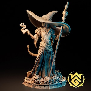 May include: A detailed miniature figurine of a female wizard with a wide-brimmed hat, holding a staff and a glowing orb. The figurine is painted in shades of brown and beige, and stands on a base with intricate details.