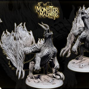 May include: Three detailed dragon figurines in a promotional image for "Monster Madness Vol. 3." The dragons are gray with textured scales, wings, and claws, posed on rocky bases. The logo is visible at the top.