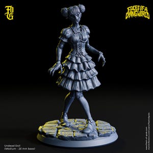 May include: A gray, 3D printed miniature of an undead doll wearing a ruffled dress and standing on a cobblestone base. The doll has a creepy expression and is missing an eye. The miniature is labeled "Undead Doll (Medium - 25 mm base)" and "Faces of a Dying World".