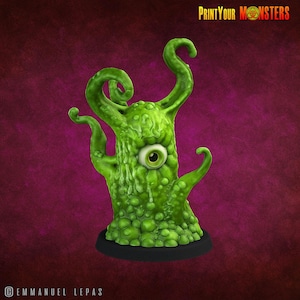 May include: A green, grotesque monster figurine with a single eye and multiple tentacles. The figurine has a textured, bumpy surface and is mounted on a black base. The text "PrintYourMonsters" is visible in the upper right corner.