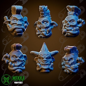 May include: Six grey 3D printed goblin heads with different hairstyles and facial expressions. The goblins have large ears, wide eyes, and sharp teeth.