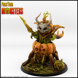 May include: A 3D printed miniature of a pumpkin creature with a skull face, horns, and vines. The creature is standing on a round base with green vines and a smaller pumpkin. The miniature is painted in orange, green, and brown colors. The text "PRINT YOUR MONSTERS SUPPORTED" is visible in the top left corner of the image.