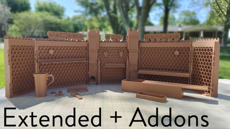 May include: A 3D printed castle wall set with towers and a honeycomb design. The set includes a variety of accessories, such as a mug, a small tray, and a long, thin box. The set is labeled "Extended + Addons".