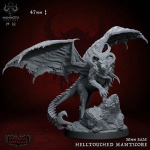 May include: Gray plastic miniature of a Helltouched Manticore, a creature with a lion's body, bat wings, and a scorpion tail. The miniature is standing on a rocky base. The miniature is 47 mm tall and has a 50 mm base.