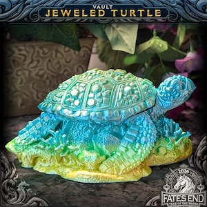 May include: A decorative turtle figurine with a shell featuring geometric, jewel-like textures. The object displays a vibrant gradient of blue, green, and yellow hues. Text at the top reads VAULT JEWELED TURTLE and at the bottom 2026 FATES END.