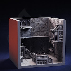 May include: A detailed, gray miniature diorama of a gothic interior. The model features staircases, arched doorways, and patterned wall panels. The cutaway design reveals multiple levels and architectural details, creating a three-dimensional effect.