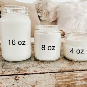 May include: Three glass candle jars with white wax. The jars are labeled with their size: 16 oz, 8 oz, and 4 oz.