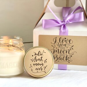 mothers day gift set with personalized candle and gift box with purple ribbon and Kraft labels