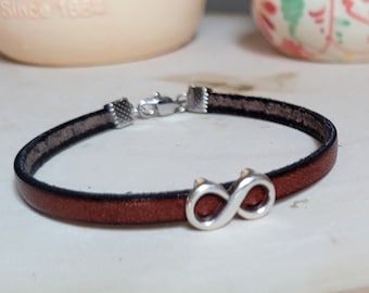 Handmade leather bracelet made with 5mm Italian leather with silver infinity symbol and sterling silver lobster claw clasp and star charm.