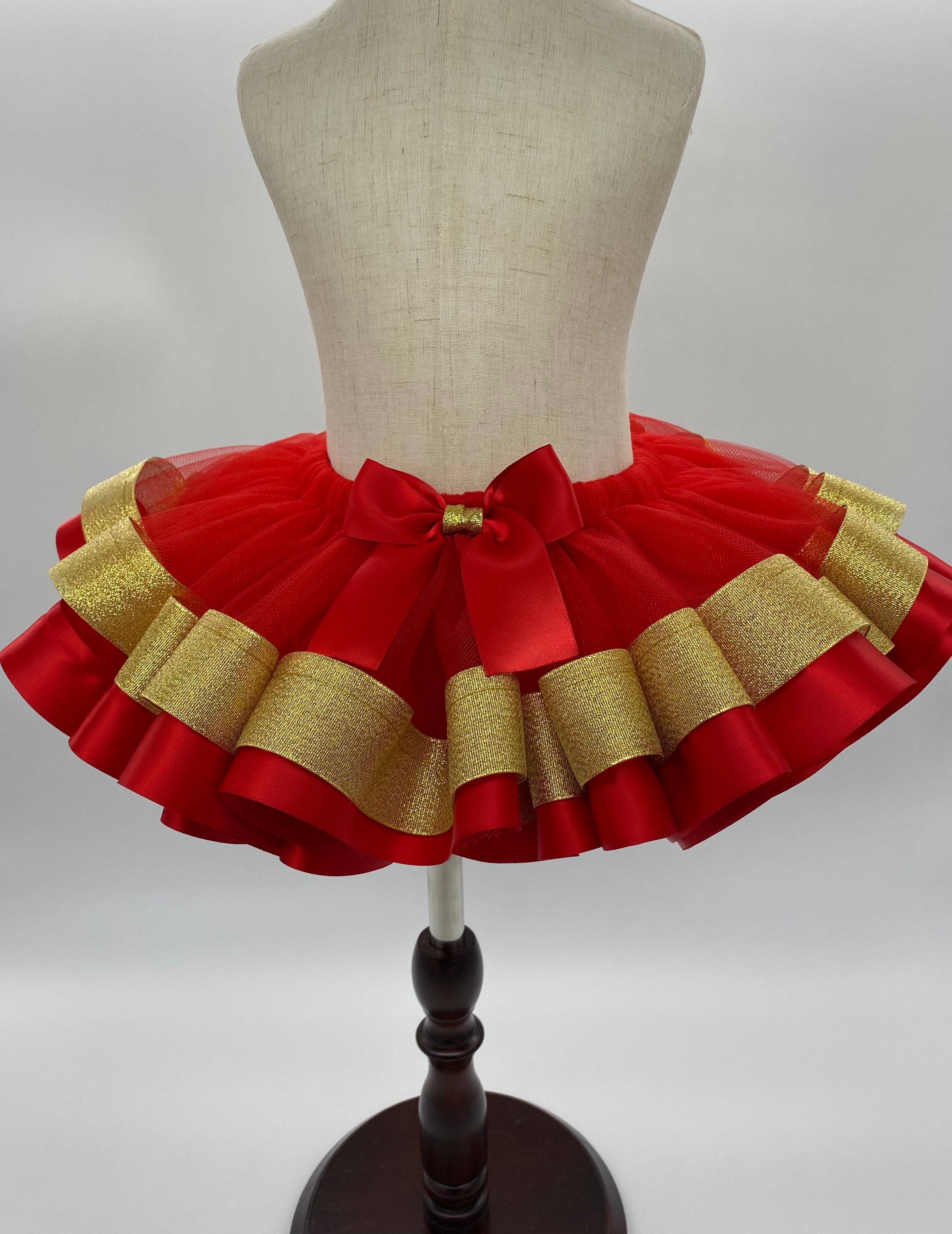 Tutu Rojo Navideño 🎄con moño en Rojo y Dorado.