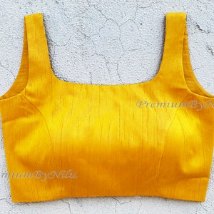 Yellow silk sleeveless readymade saree blouse square neck deep back openable from back side  with hooks and padded