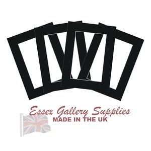 May include: Four black mat boards with white openings for framing photos or artwork. The mats are made by Essex Gallery Supplies and are made in the UK.