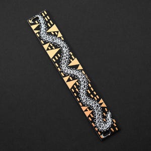 May include: A set of three ceramic mugs with a speckled, matte finish. The mugs are in shades of cream, light gray, and dark gray. Each mug has a simple, minimalist design, perfect for coffee or tea.