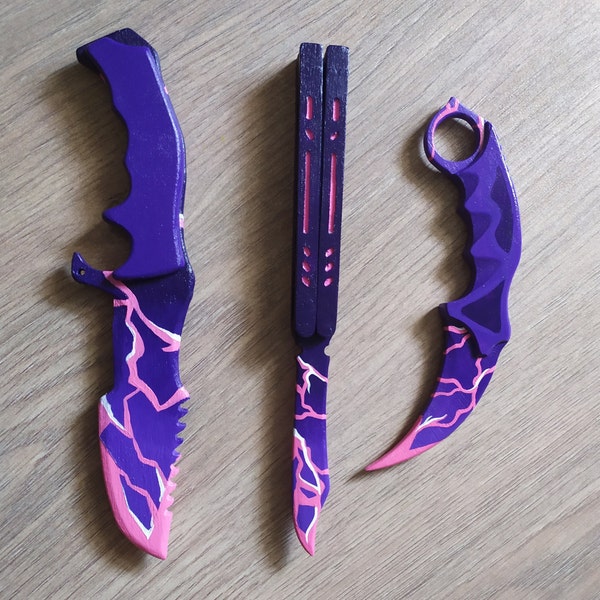 A set of wooden knives toy in colors Universe knife butterfly, hunter, karambit