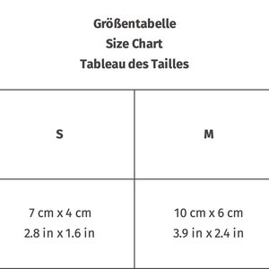 May include: Size chart table showing measurements in inches and centimeters for sizes S, M, and L. The measurements are for width and height.