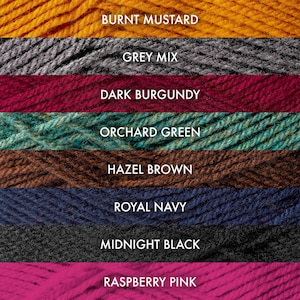 May include: A collection of yarn skeins in various colors, including burnt mustard, grey mix, dark burgundy, orchard green, hazel brown, royal navy, midnight black, and raspberry pink.