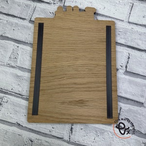 May include: A wooden sign with a black magnetic strip on each side. The sign is blank and ready to be personalized. The sign is made of natural wood and has a rustic look.
