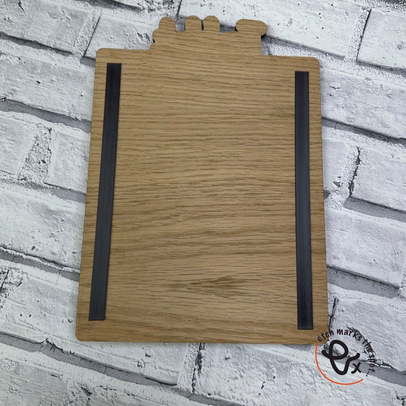 May include: A wooden sign with a black magnetic strip on each side. The sign is blank and ready to be personalized. The sign is made of natural wood and has a rustic look.