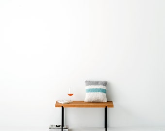 Small bench made of oiled oak usable as a practical shelf, sideboard or bench