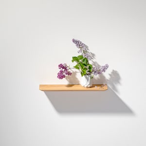 Floating wall shelf made of oak wood in different lengths