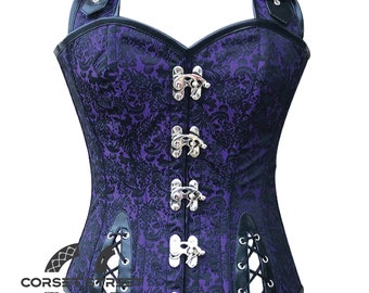 May include: A purple and black corset with a floral pattern. The corset has a halter neck design with black leather straps and silver clasps down the front. It features black trim and lace-up detailing.
