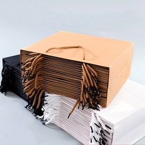 100pcs logo personalizzato stampa sacchetti di carta marrone Gft con manici all'ingrosso
