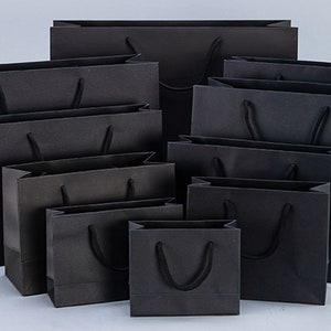 Bolsas de regalo de papel negro personalizadas al por mayor, bolsas de compras pequeñas personalizadas para ropa o joyas