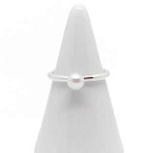TSUKI. Simple ring with a freshwater pearl. Handmade from 925 silver.