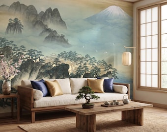 May include: A wall mural featuring a landscape painting of a snow-capped mountain, misty peaks, and pine trees behind a beige sofa with blue and gold pillows, a wooden coffee table with a bonsai tree, and a floor lamp with a cylindrical shade.