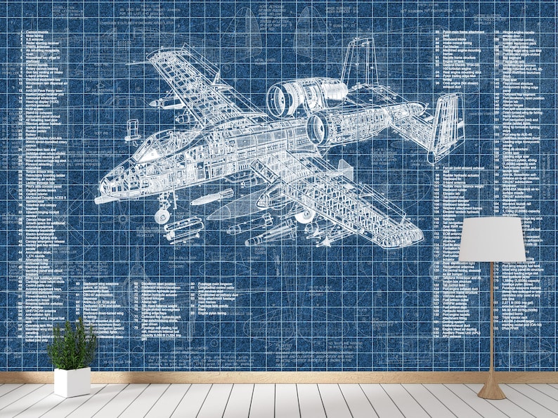 May include: A blue wall mural featuring a detailed white technical blueprint of an A-10 Thunderbolt II aircraft. The design includes extensive numbered parts lists on both sides of the central plane illustration, set against a grid background.