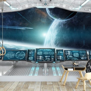 May include: A futuristic-themed room with a large window overlooking a space scene with planets and stars. The room features multiple computer screens, a small table, a chair, and a chalkboard sign that says "Home of the Cool Kids". Wooden gymnastic rings hang from the ceiling.
