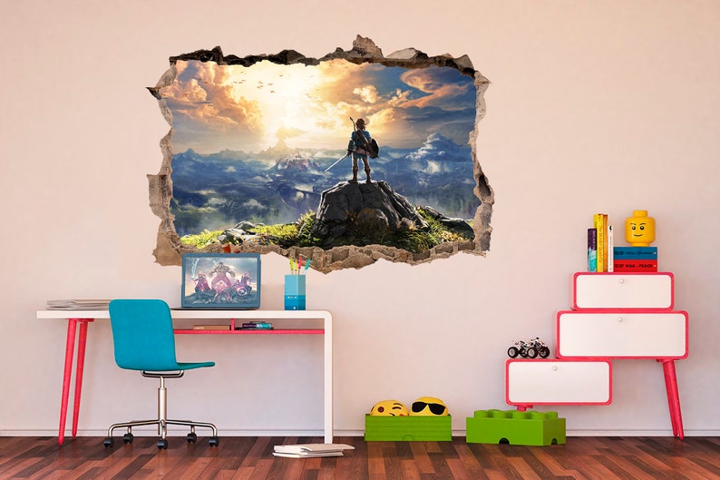 May include: A wall decal featuring a video game character standing on a cliff overlooking a mountain range. The decal is designed to look like a hole in the wall, creating a 3D effect.